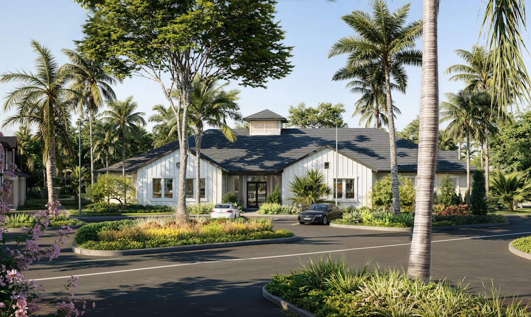 The welcoming exterior of a beautifully maintained suburban home on a sunny day, showcasing excellent curb appeal with a green lawn and fresh paint.