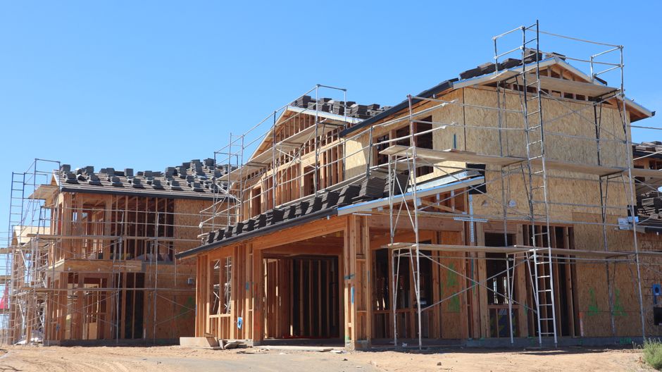 The clean, organized structure of a modern commercial building under construction, shown in bright, professional lighting to convey efficiency and progress.